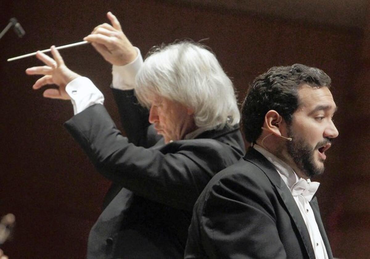 Tenor Rene Barbera, right, performs William Bolcom's "Canciones de Lorca" with the Pacific Symphony conducted by Carl St.Clair.
