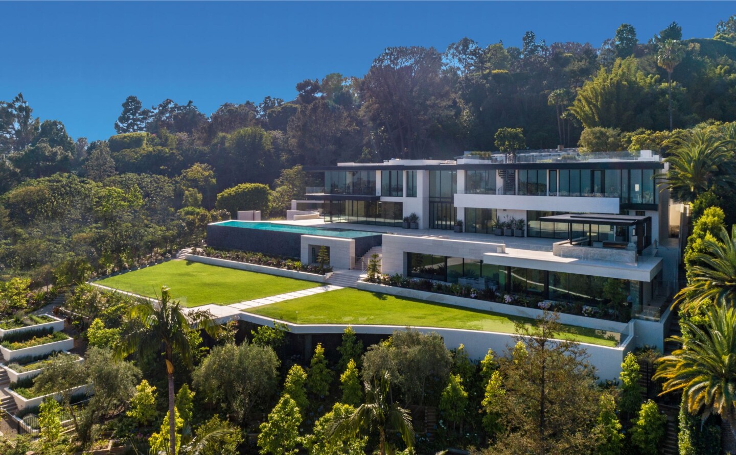 Spanning three stories, the 34,000-square-foot spec mansion boasts nine bedrooms, 20 bathrooms and a 90-foot swimming pool.