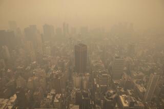 An aerial view shows New York City in a haze-filled sky from the Empire State Building observatory, Wednesday, June. 7, 2023, in New York. Smoke from Canadian wildfires poured into the U.S. East Coast and Midwest on Wednesday, covering cities of both nations in an unhealthy haze, holding up flights at major airports and prompting people to fish out pandemic-era face masks. (AP Photo/Yuki Iwamura)