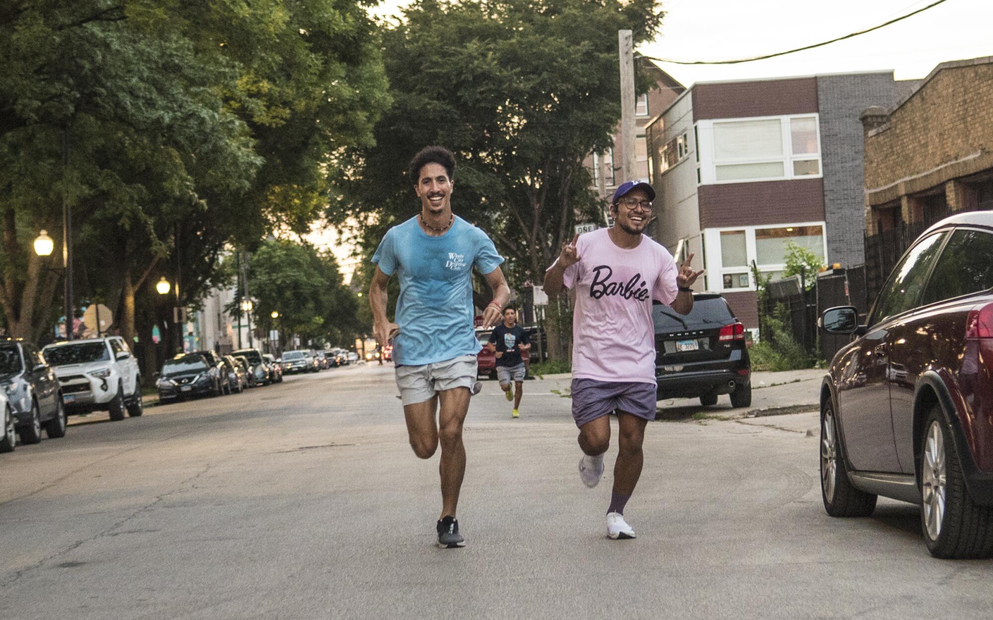 Two men run in Chicago.