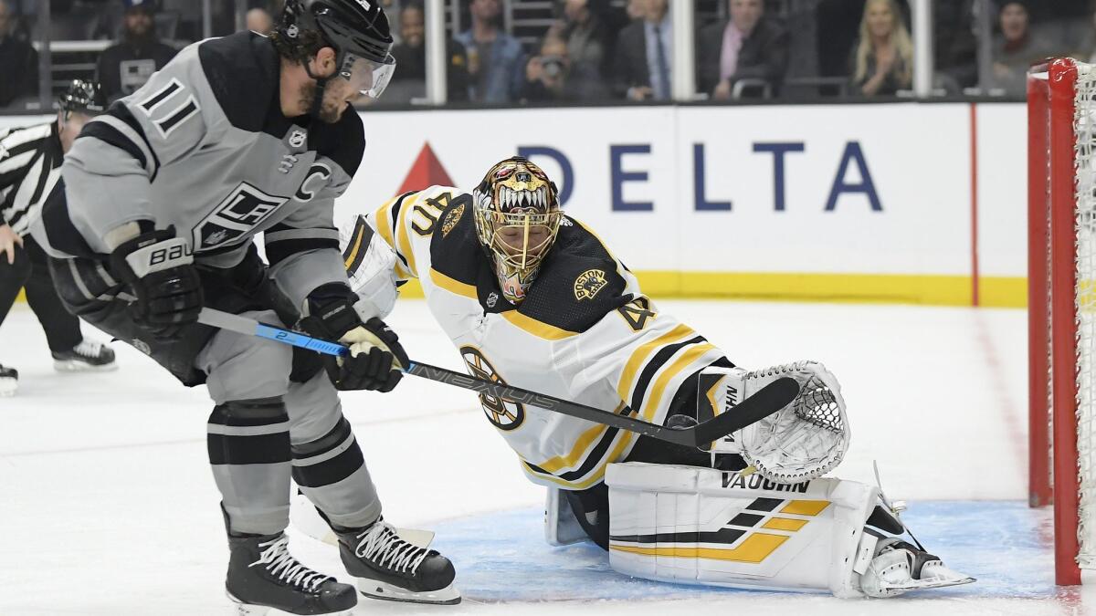 Boston Bruins goaltender Tuukka Rask, right, stops a shot by Kings center Anze Kopitar during the second period on Saturday.