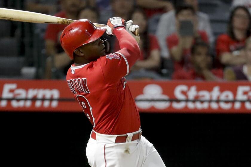 Los Angeles Angels' Justin Upton watches his home run against the Seattle Mariners during the seventh inning of a baseball game in Anaheim, Calif., Thursday, Sept. 13, 2018. (AP Photo/Chris Carlson)