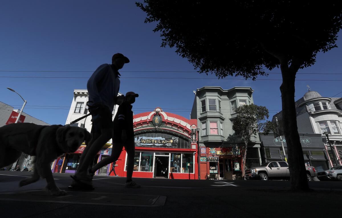 Pedestrians walk along Haight Street in San Francisco.