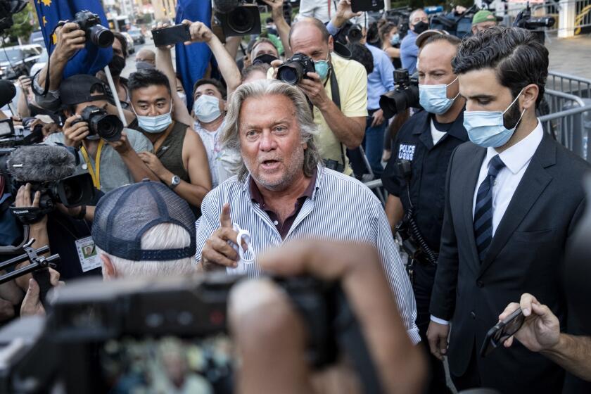 President Donald Trump's former chief strategist Steve Bannon leaves federal court, Thursday, Aug. 20, 2020, after pleading not guilty to charges that he ripped off donors to an online fundraising scheme to build a southern border wall. (AP Photo/Craig Ruttle)