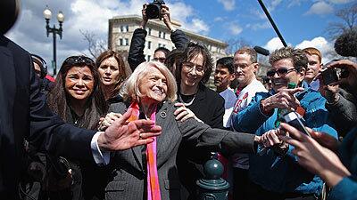 Edith Windsor, 83, is mobbed by journalists and supporters as she leaves the Supreme Court on Wednesday. Windsor brought the case challenging the constitutionality of the federal Defense of Marriage Act.