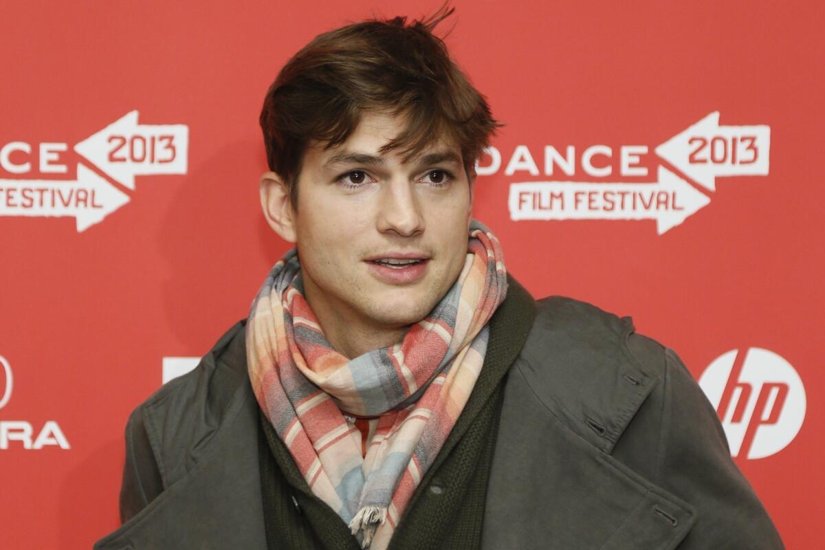 Actor Ashton Kutcher, who portrays Apple's Steve Jobs in the film "jOBS," poses at its premiere during the 2013 Sundance Film Festival in Park City, Utah.