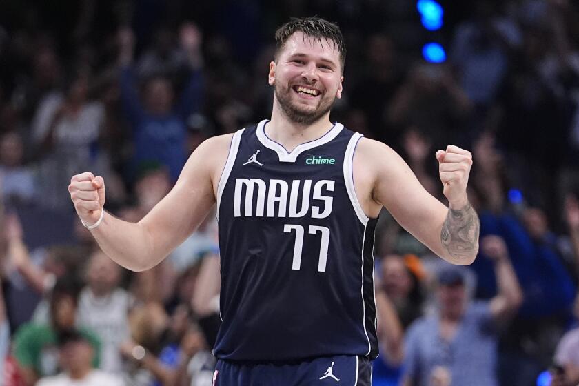 Dallas Mavericks guard Luka Doncic (77) reacts after a play during the first half in Game 4.