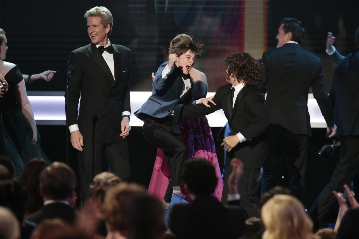 "Stranger Things" actor Finn Wolfhard leaps for joy as his show wins the ensemble award.