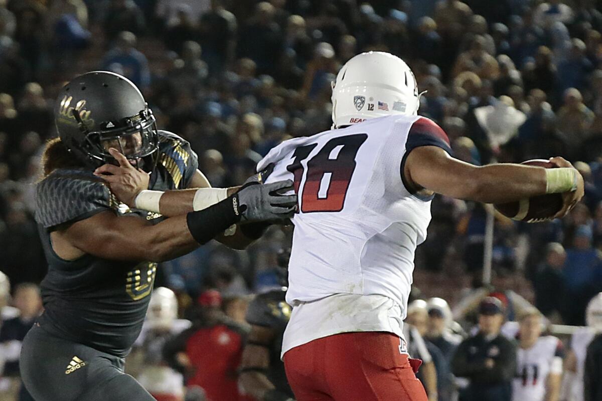 UCLA linebacker Eric Kendricks forces Arizona quarterback Anu Solomon to scramble late in the fourth quarter of their game Nov. 1.