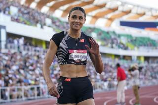 Sydney McLaughlin-Levrone waves to the crowd after winning the women's 400 meters during the U.S. track championships