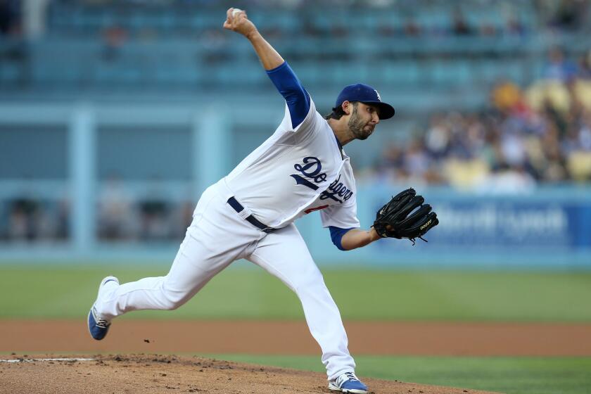 Mike Bolsinger throws a curveball for the Dodgers against the Oakland Athletics on July 29.