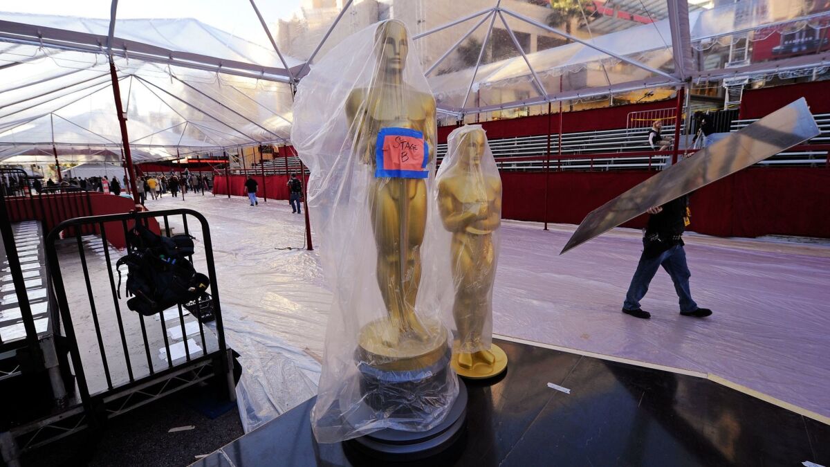Oscar statues are covered with plastic on the red carpet arrival area in preparation for the 82nd Academy Awards at Hollywood & Highland on March 3, 2010, in Hollywood.