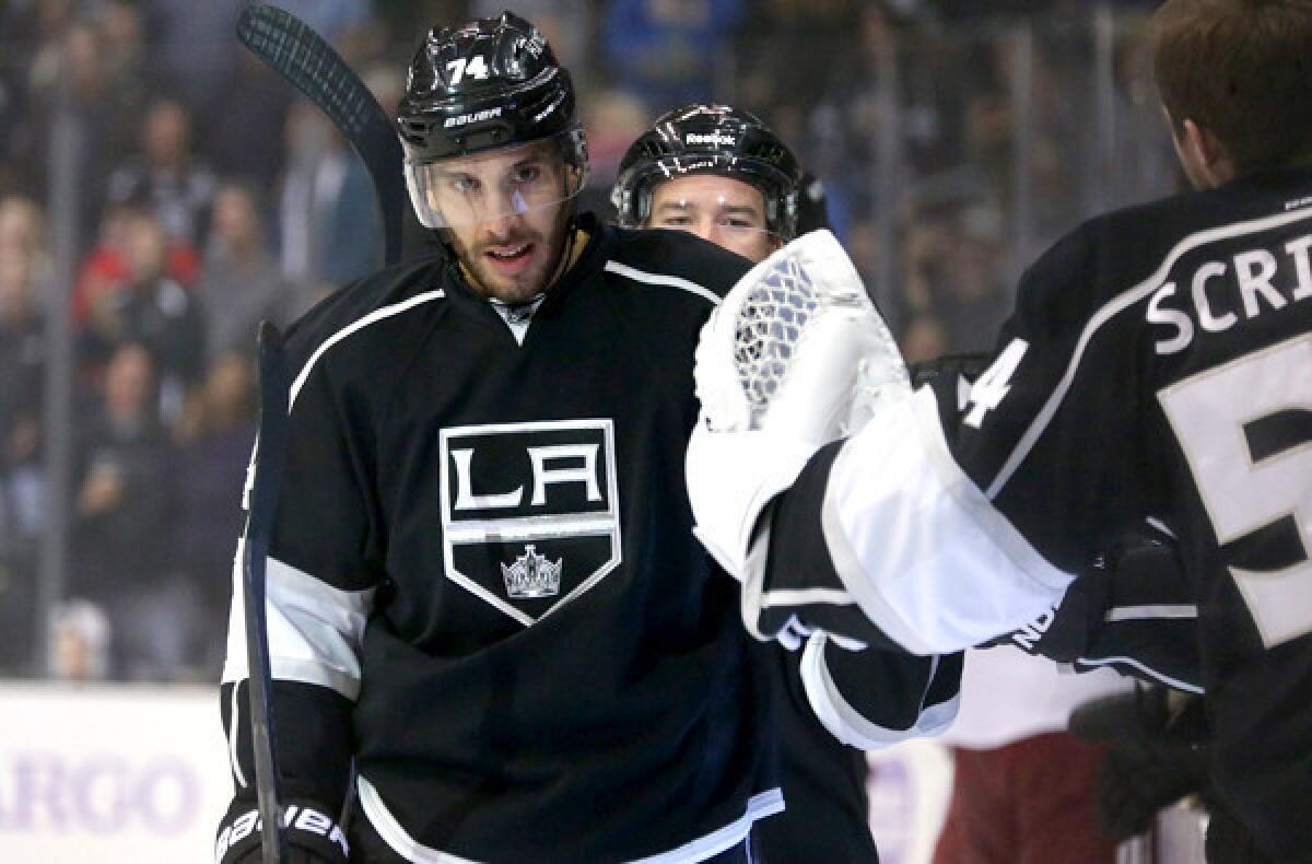 Kings forward Dwight King is congratulated by goalie Ben Scrivens after scoring one of two goals against the Phoenix Coyotes earlier this season at Staples Center.