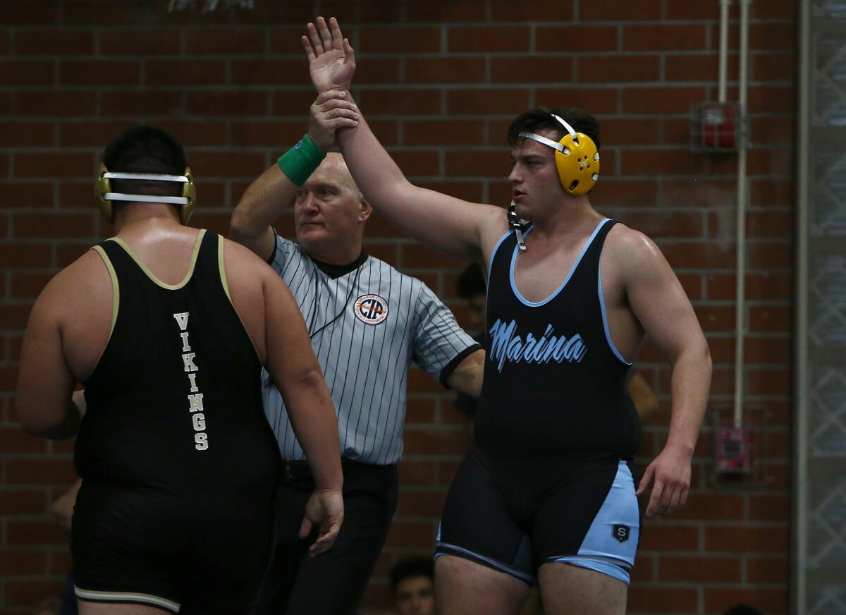 Marina's Ethan Esparza, right, defeats Northview's Anthony Troncoso in the 285-pound final.