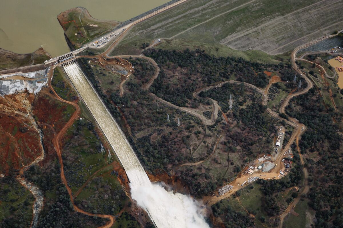 Water flows out of the main spillway at Oroville Dam in Northern California, which generates emissions-free hydropower.
