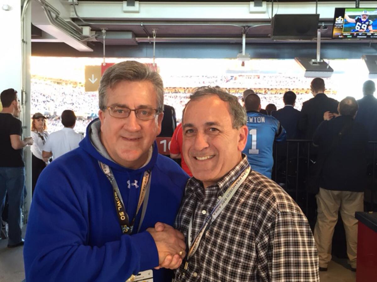 Former Iran hostage, Rocky Sickmann, left, with Alex Paen, at Super Bowl 50. Paen was able to bring audio recordings of Super Bowl XIV to the hostages.