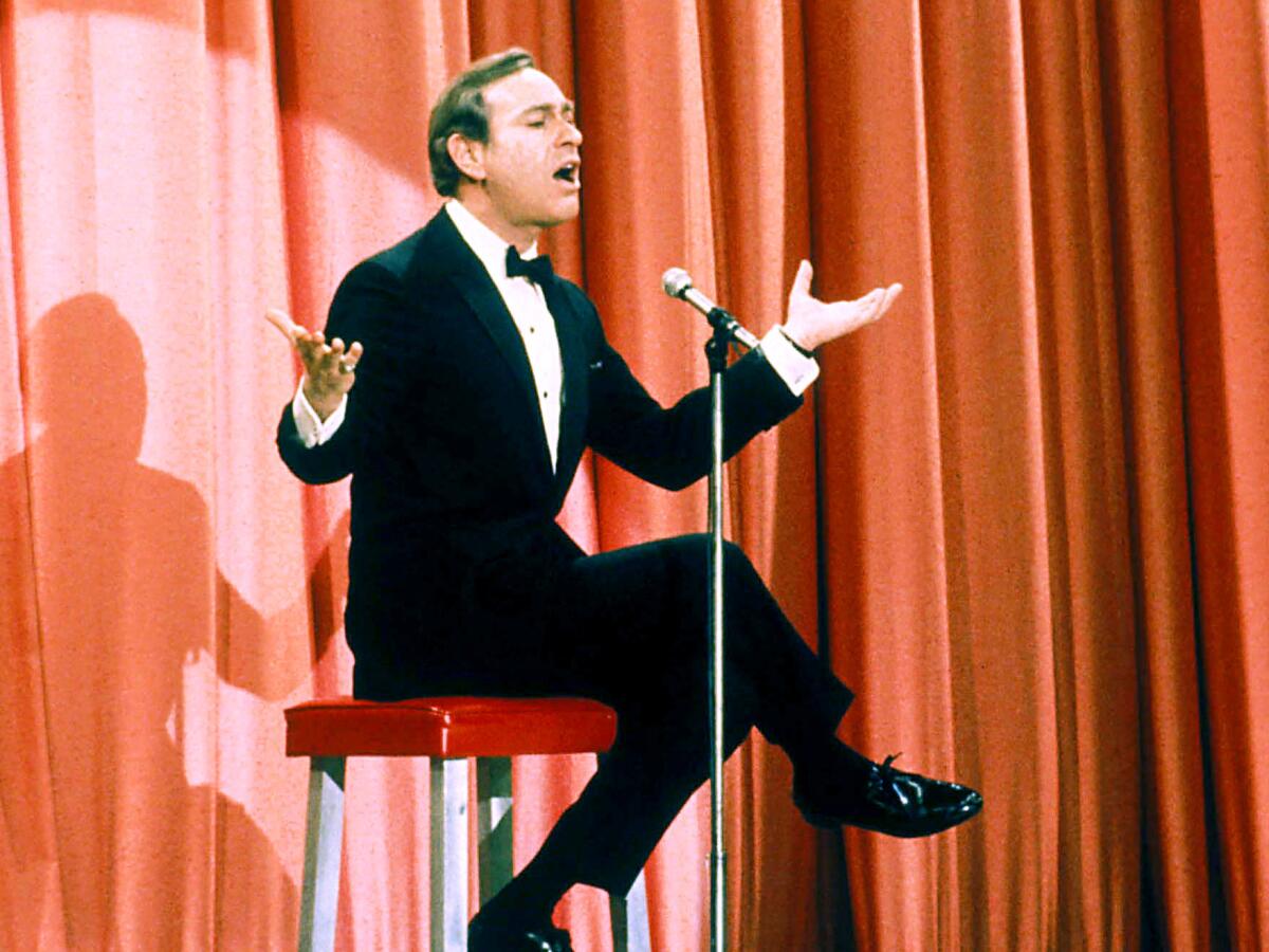 Shelley Berman performed his comedy routines, such as this one circa 1970, sitting on a custom stool.