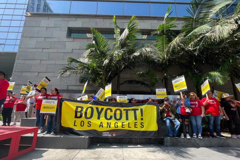 Hotel workers represented by Unite Here Local 11 picketed outside the JW Marriott Hotel in downtown Los Angeles on Thursday morning. After several tense and sometimes violent incidents on hotel picket lines, the union on Thursday calling for a boycott of hotels who have not yet reached a contract.