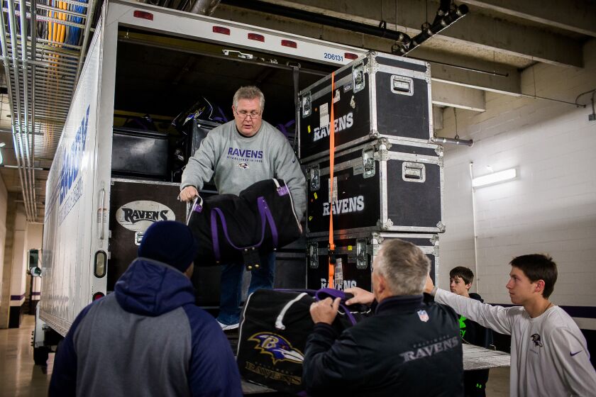 Volunteers Jerry Bolling is unloading bags. (Shawn Hubbard/Ravens)