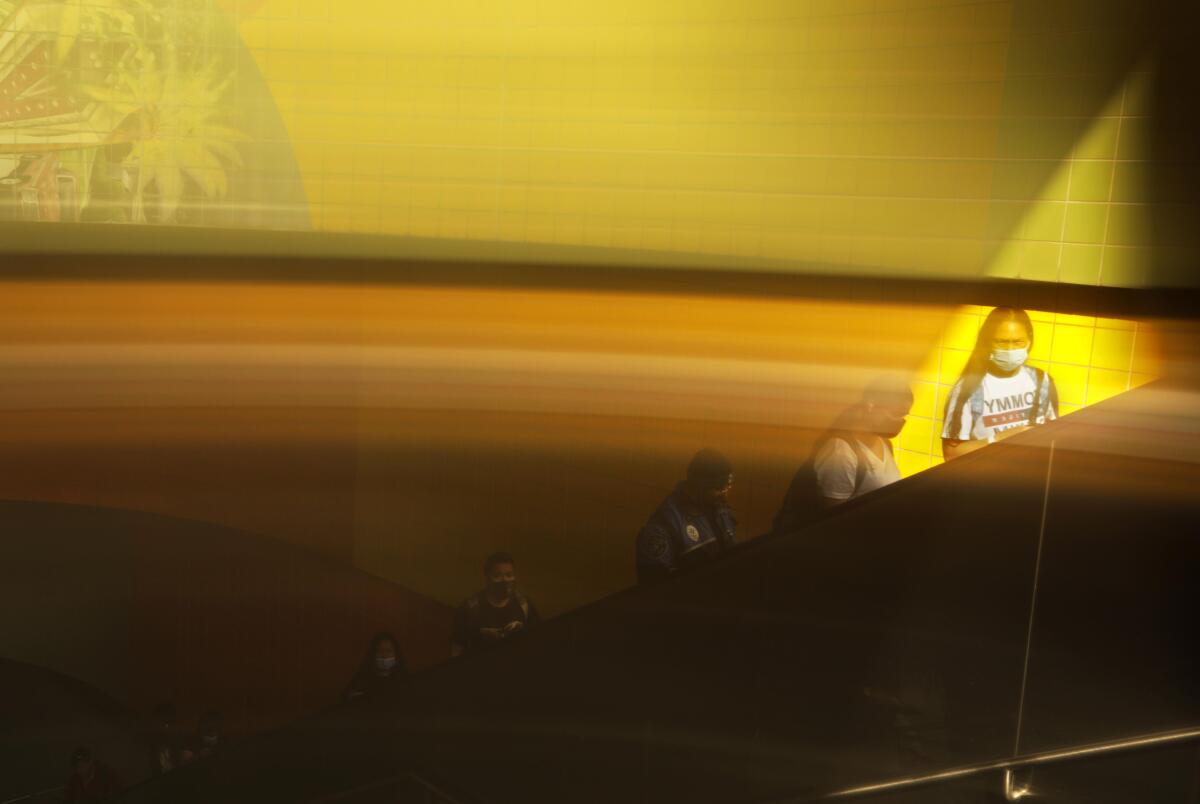 Commuters at the North Hollywood Metro station.