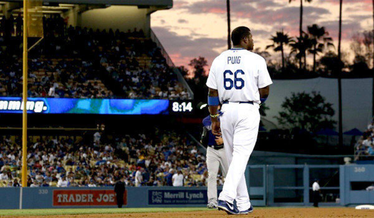 Outfielder Yasiel Puig was taken out of the Dodgers' game against the Colorado Rockies during the fifth inning as a precautionary measure because of an aggravated left hip.