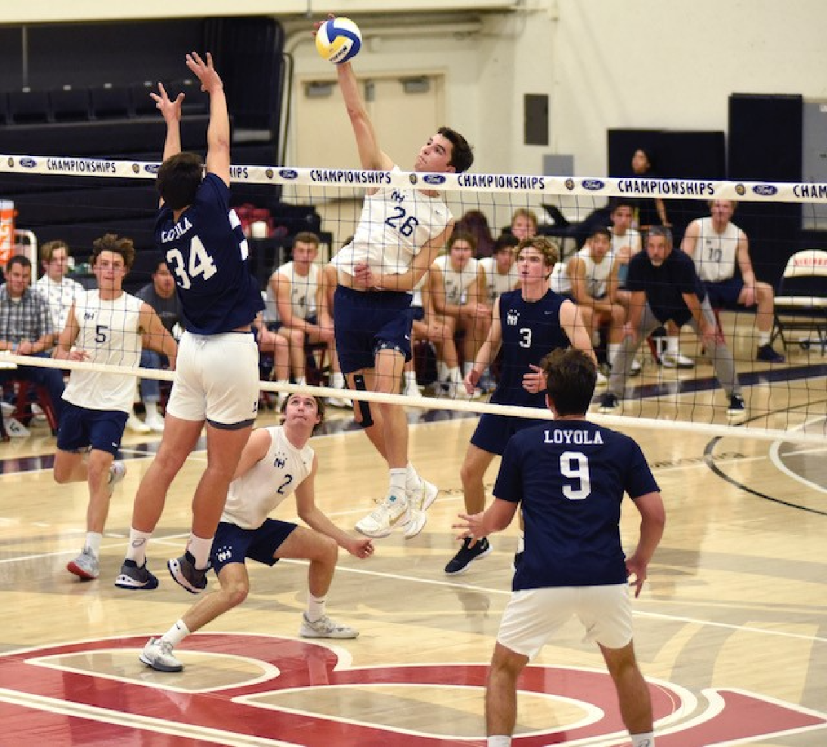 Newport Harbor's James Eadie (26) spikes the ball vs. Loyola during the Southern Section Division I title match May 14, 2022.