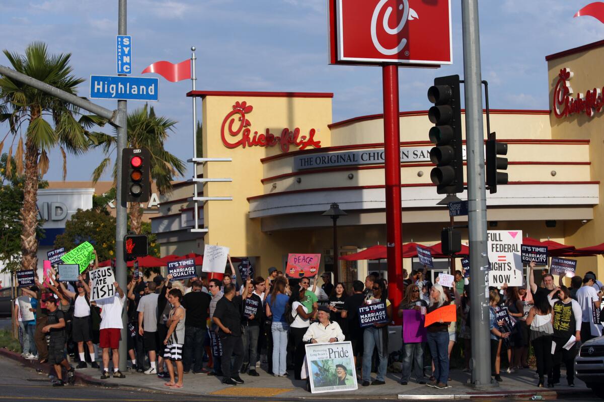 Last year, demonstrators gathered outside a Chick-fil-A in Hollywood to protest comments on gay marriage made by the company's president. Now a gay-rights group says a review of tax forms shows no donations to groups opposing same-sex marriage.