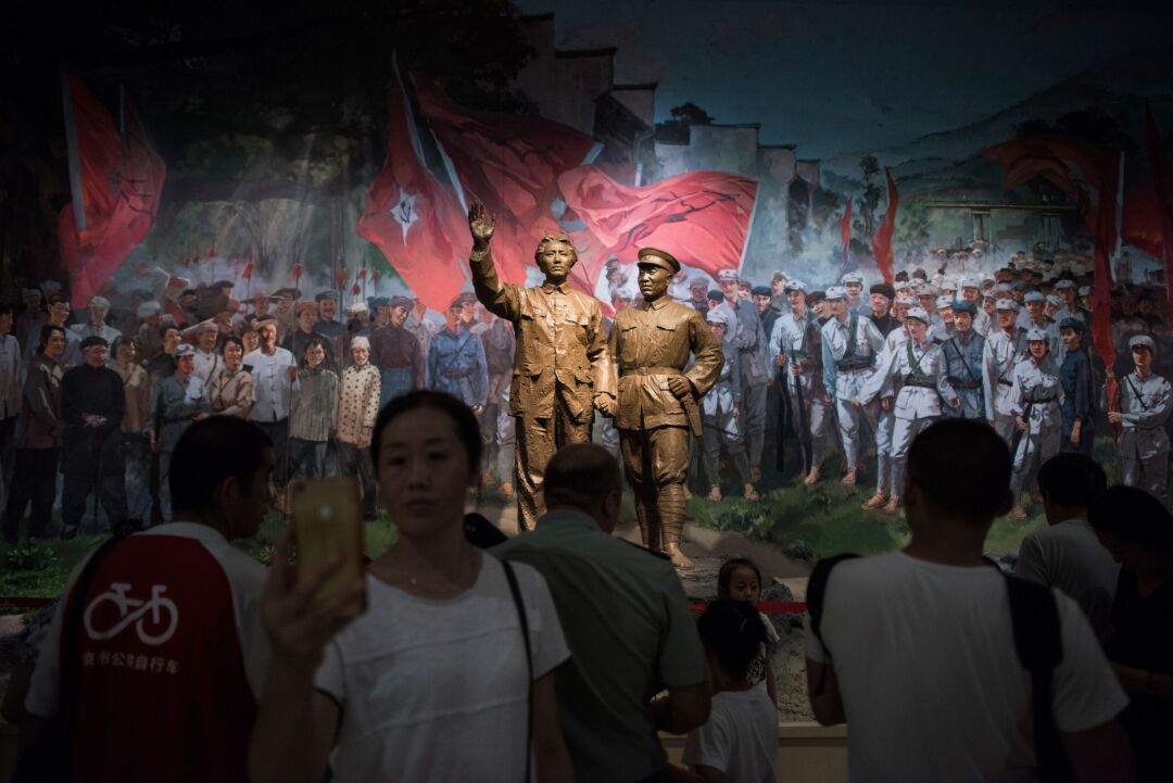 Visitors gather before an exhibit at the Military Museum in Beijing.