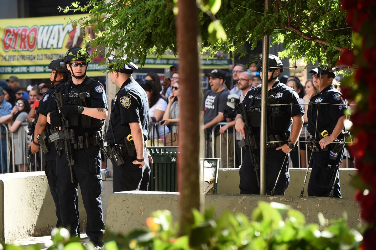 Police officers stand guard outside the Tony Awards at the Beacon Theatre on Sunday in New York.