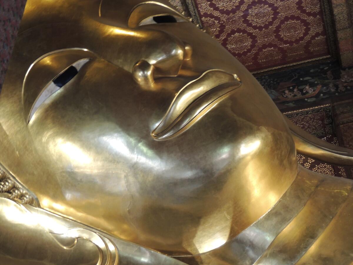The face of the Reclining Buddha in Bangkok.