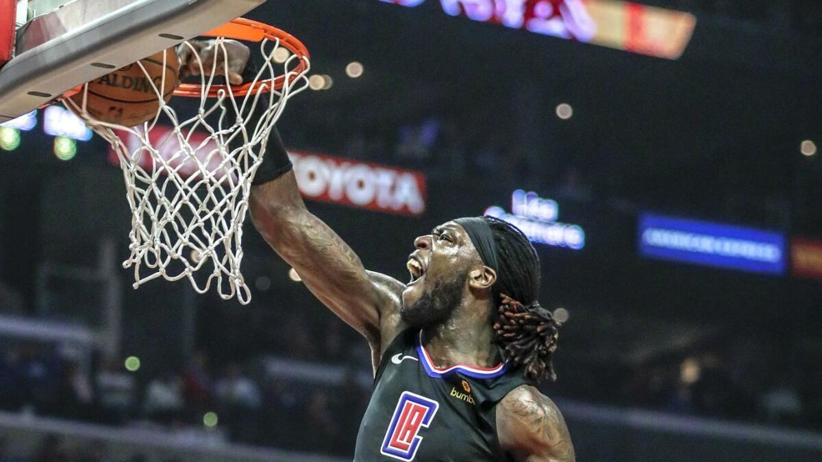 Clippers' Montrezl Harrell slams down a basket during first half action at Staples Center.