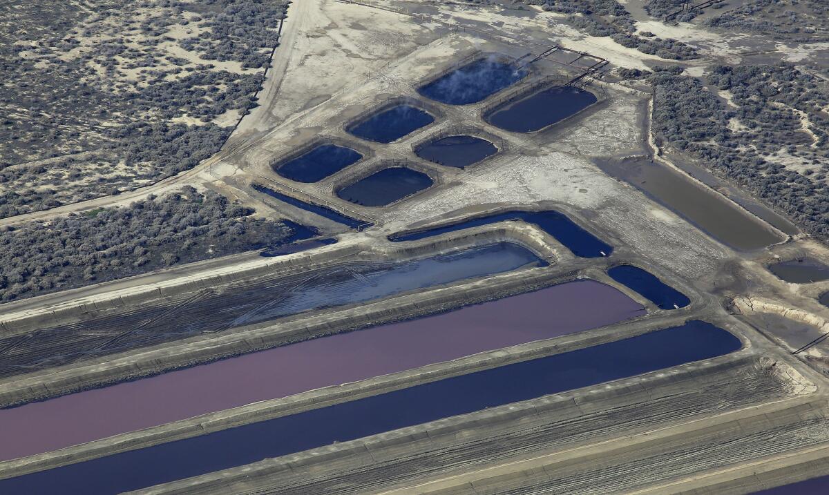 Aerial view of pits containing production water from oil wells near Hwy. 33 and Lokern Road in Kern County.