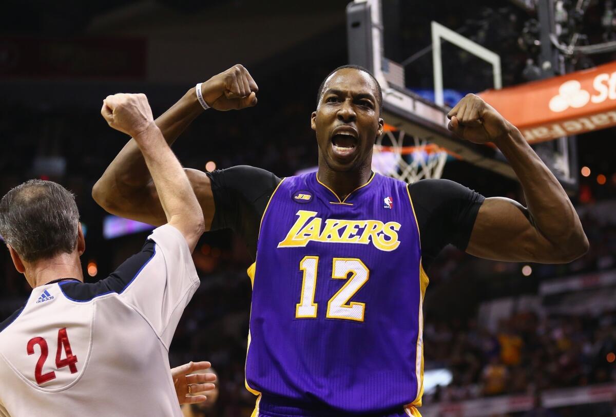 Lakers center Dwight Howard flexes after drawing a foul during Game 2 against the Spurs.