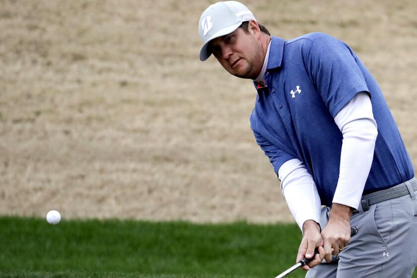 Hudson Swafford chips onto the 11th green during the second round of the CareerBuilder Challenge on Friday.