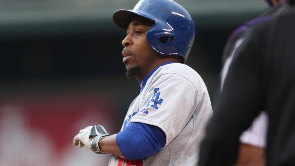 Dodgers veteran infielder Chone Figgins reacts after drawing a walk against the Colorado Rockies on June 8. Figgins was cut by the Dodgers on Wednesday.