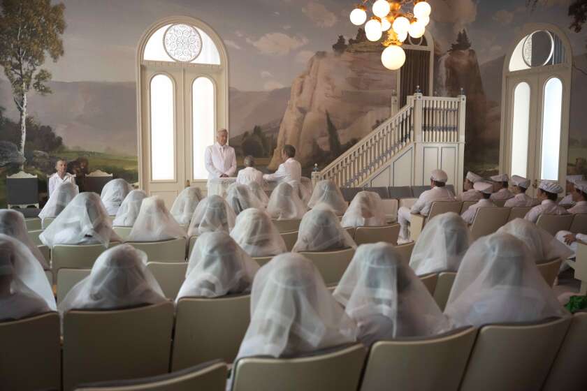 A church ceremony with worshipers dressed all in white