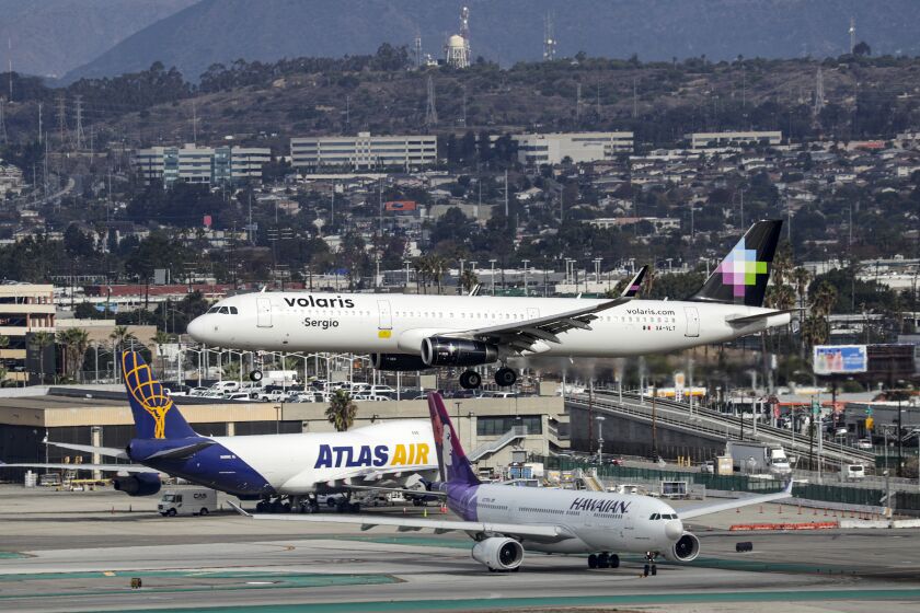 LOS ANGELES, CA - NOVEMBER 30, 2019 — A plane lands at Los Angeles Airport on November 30, 2019, Los Angeles. There is a significant chance of rain late afternoon. (Irfan Khan / Los Angeles Times)