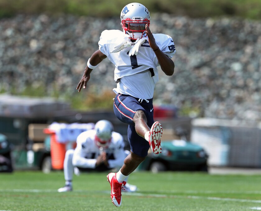 Newly signed New England Patriots wide receiver Antonio Brown, wearing the number 1, makes his debut at New England Patriots practice at Gillette Stadium in Foxborough, Mass., on Wednesday. Behind him is new teammate Gunner Olszewski.