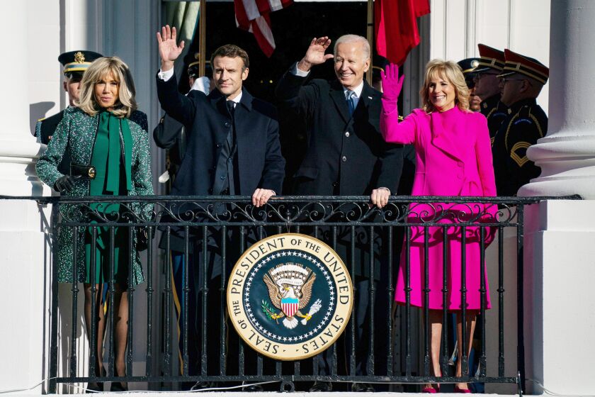 WASHINGTON, DC - DECEMBER 01: President Joe Biden, center, First Lady Dr. Jill Biden welcome French President Emmanuel Macron and his wife Brigitte Macron during an arrival ceremony on the South Lawn of the White House on Thursday, Dec. 1, 2022 in Washington, DC. Macron's visit to the White House on Friday includes the first State Dinner of Biden's Presidency. (Kent Nishimura / Los Angeles Times)