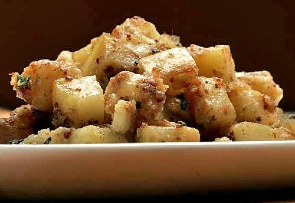 Potatoes are baked, then chilled, diced and finally sauteed.