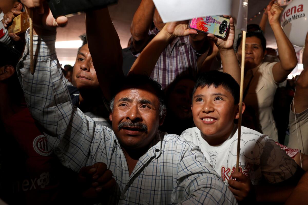 Supporters of Andres Manuel Lopez Obrador greet the Mexican presidential candidate at a campaign rally in Ecatepec.