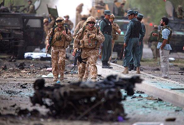 Italian soldiers arrive at the scene of suicide bombing that struck an Italian military convoy in Kabul, Afghanistan, killing six soldiers and 10 civilians and wounding at least 52 people. It was at least the fourth blast in the Kabul area since the Aug. 20 presidential election.