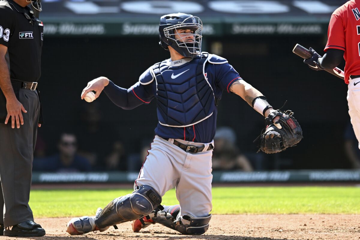 FILE - Minnesota Twins catcher Gary Sánchez (24) works behind the plate during the sixth inning of a baseball game against the Cleveland Guardians, Monday, Sept. 19, 2022, in Cleveland. Sánchez agreed to a minor league contract with the San Francisco Giants and will report to Triple-A Sacramento. (AP Photo/Nick Cammett, File)