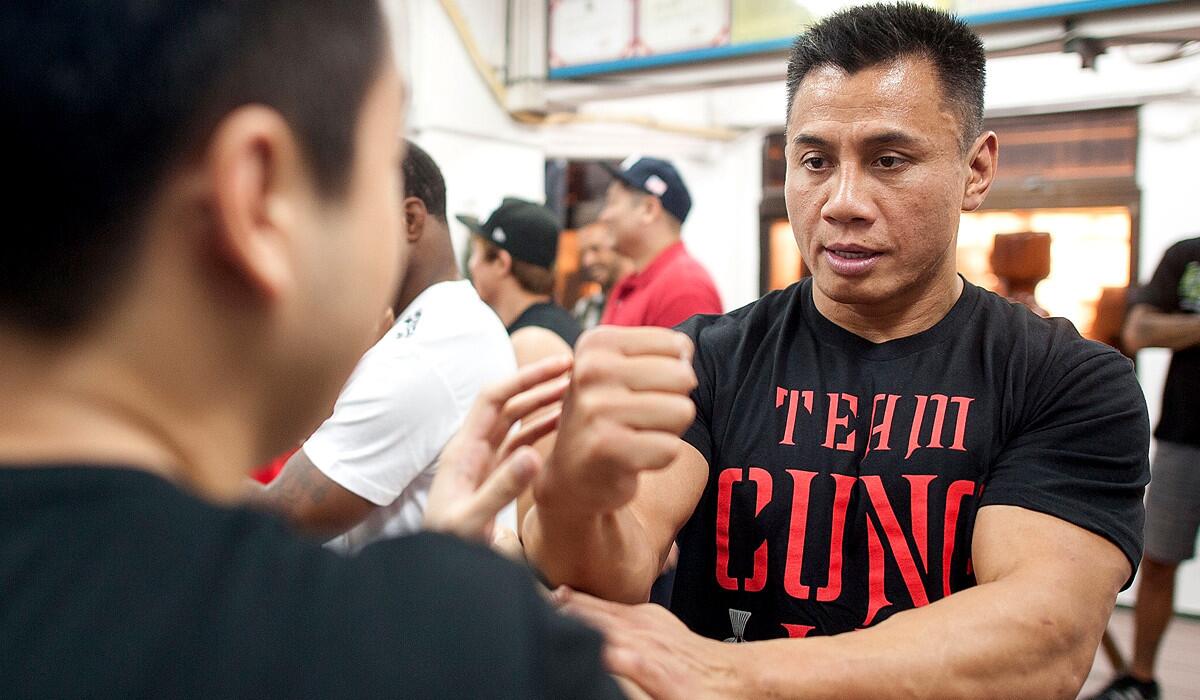 UFC middleweight fighter Cung Le practices Wing Chun during a training session in Hong Kong before his bout against Michael Bisping this summer.