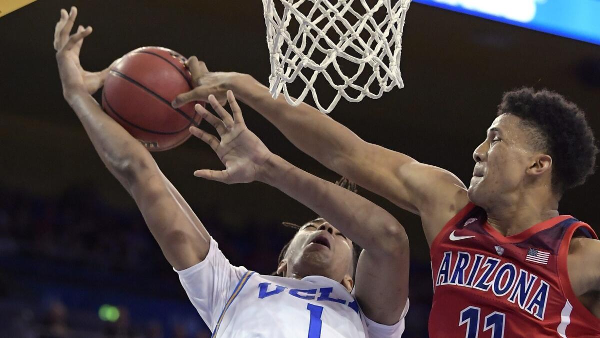 Arizona forward Ira Lee, right, blocks the shot of UCLA center Moses Brown on Jan. 26.