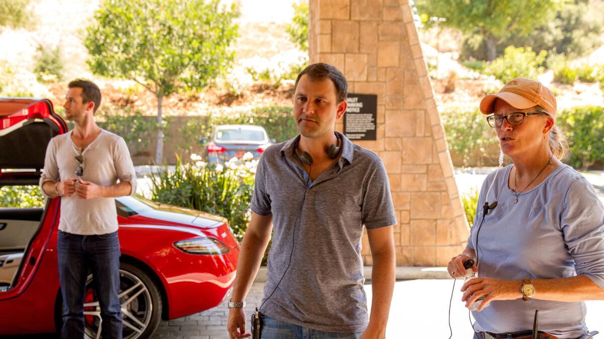 Director Dan Fogelman, center, on set during the production of the film, "Danny Collins."
