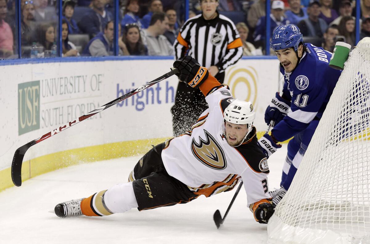 Ducks left wing Matt Beleskey is tripped by Lightning center Brian Boyle in the first period Sunday.
