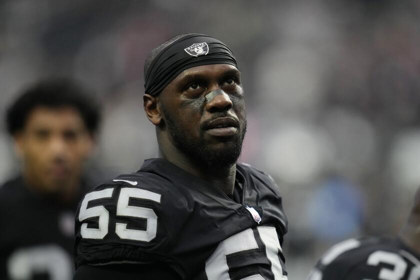 FILE - Las Vegas Raiders defensive end Chandler Jones (55) warms up before an NFL football game against the New England Patriots, Monday, Dec. 19, 2022, in Las Vegas. Las Vegas Raiders defensive end Chandler Jones indicated in since-deleted social media posts on Tuesday, Sept. 5, 2023, that he no longer wanted to play for coach Josh McDaniels and general manager David Ziegler.(AP Photo/John Locher, File)