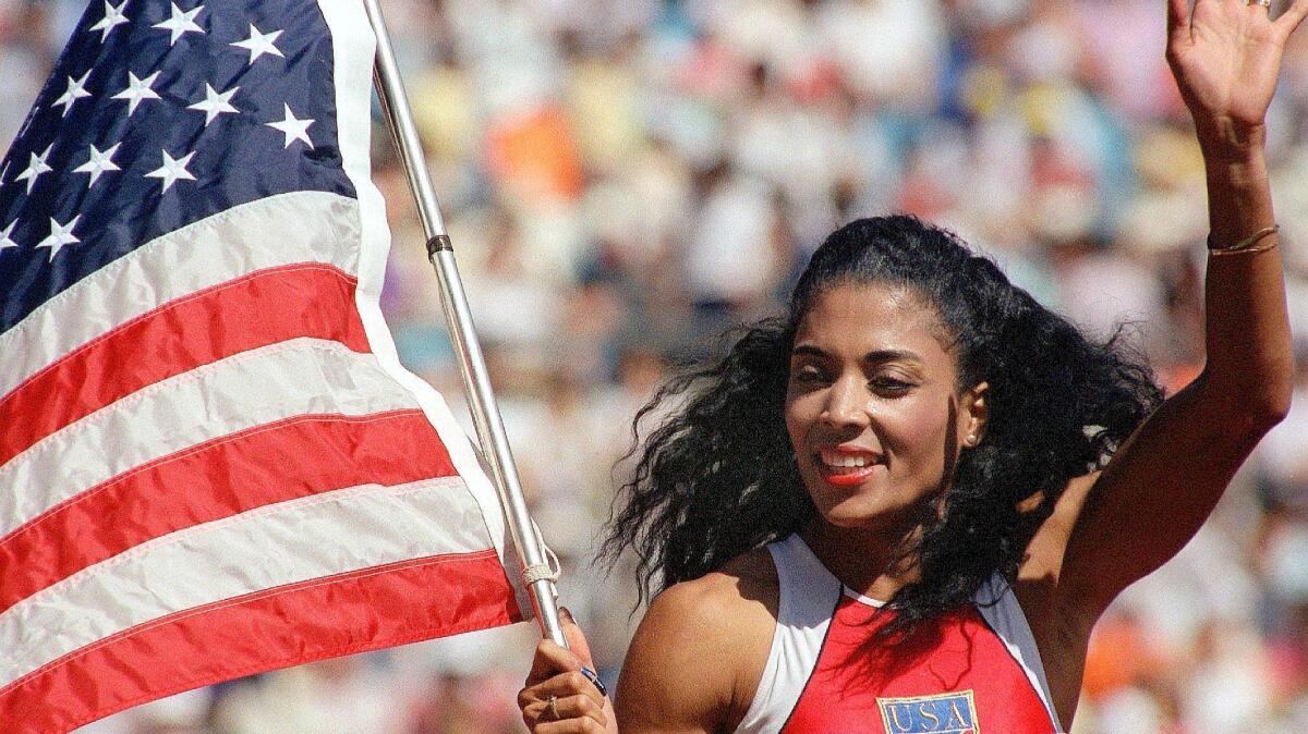 A photo dated Sept. 25, 1988, of U.S. sprinter Florence Griffith-Joyner waving the flag after winning the women's 100-meter sprint final at the 1988 Olympic Games in Seoul.