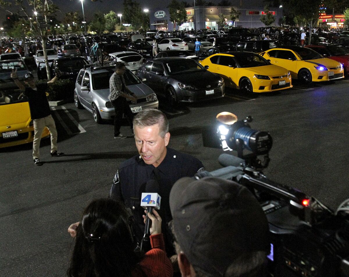 Darin Ryburn of the Burbank Police Department talks to a reporter during the 2013 car meet-up at the Empire Center. Police are beefing up their presence at this year's gathering.
